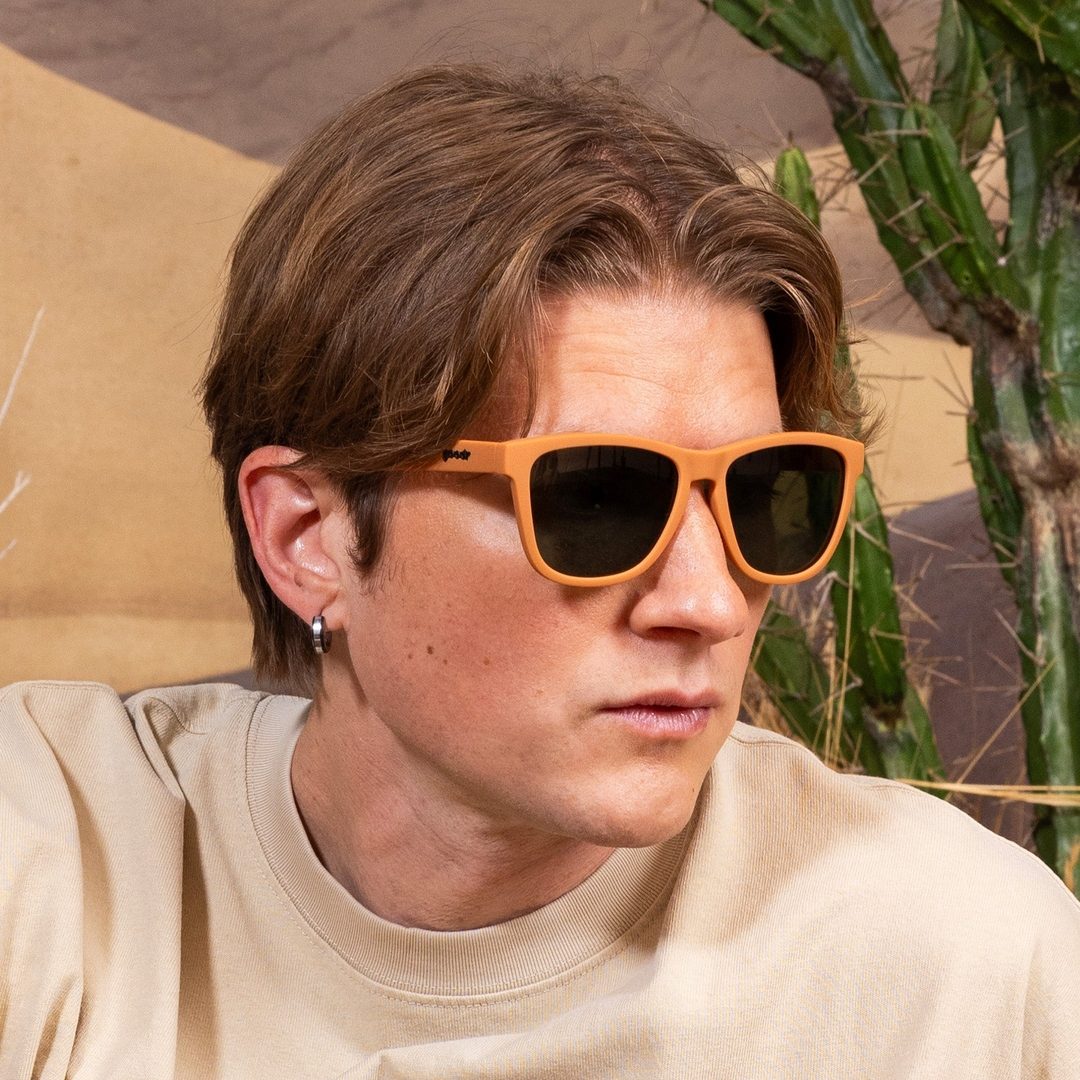 Rare Air Discs Chocolatier's Caramel Hot Tub polarized sunglasses on a lifestyle model, showcasing stylish accessories for sunny days.