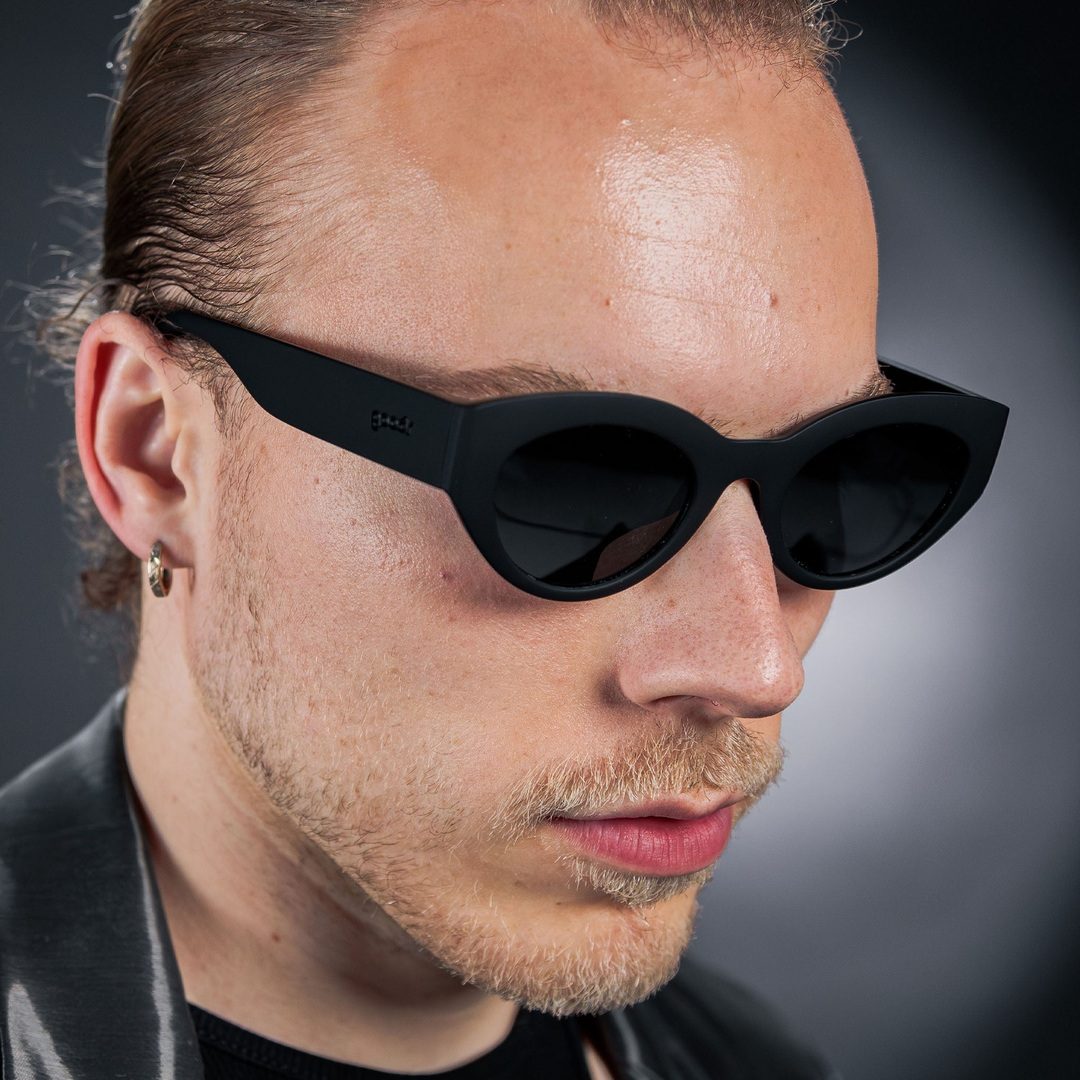Rare Air Discs "In My Cosmic Era" Moon G polarized sunglasses on a lifestyle model, showcasing sleek accessories with reflective lenses.