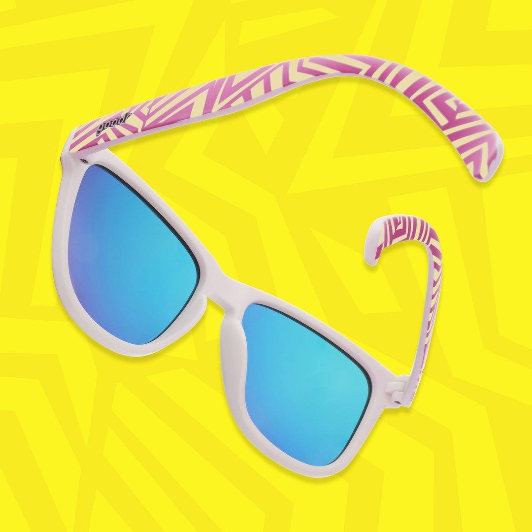 Color-changing OG polarized sunglasses with neon accents by Rare Air Discs, shown in a lifestyle setting.