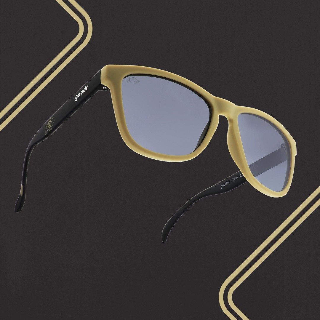 Pair of Rare Air Discs "Let's Go Buffs" CU Collegiate OG polarized sunglasses with black frames and tinted lenses, styled outdoors.
