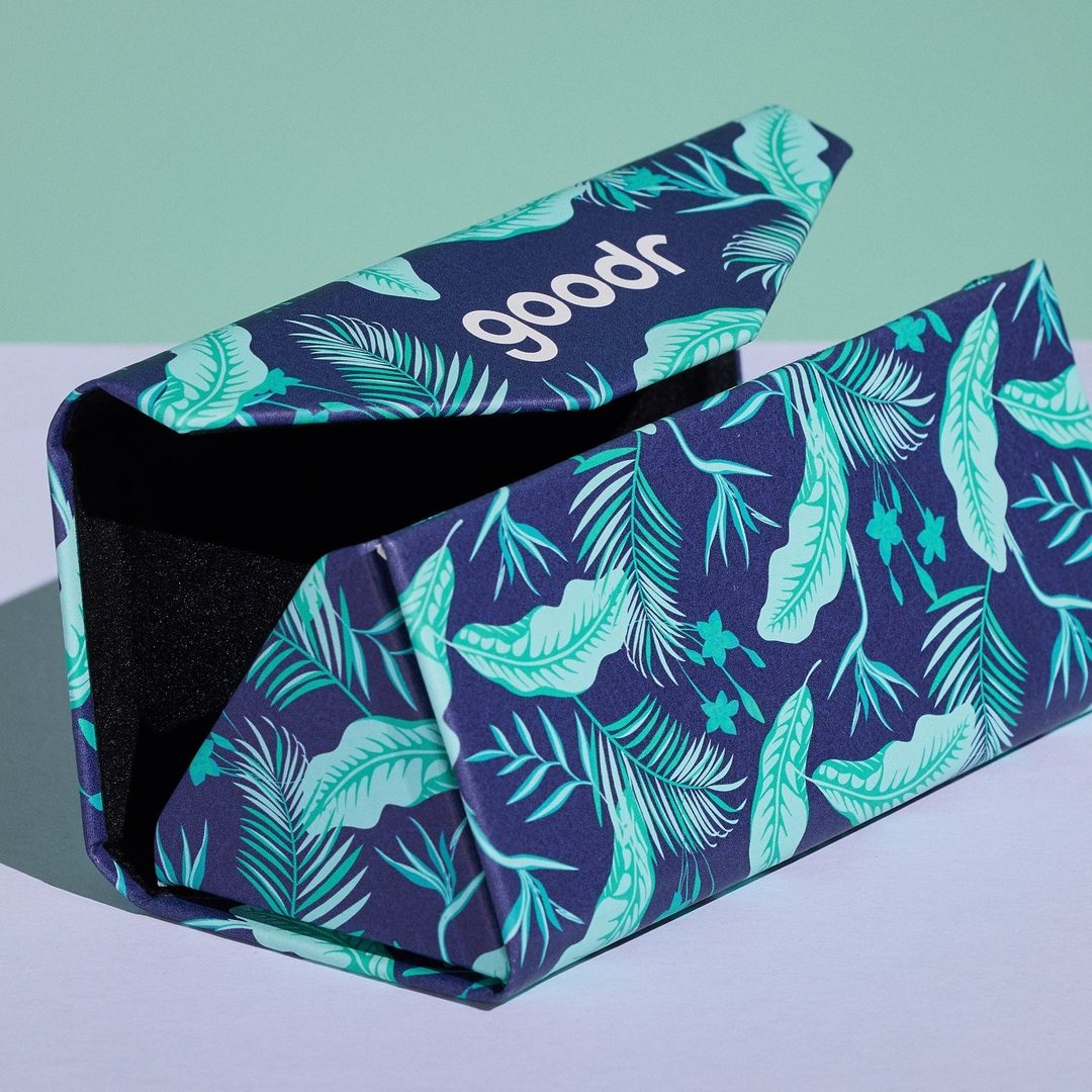 Rare Air Discs "Enter The Fold" folding sunglasses case in sleek accessory design, shown in a lifestyle setting.
