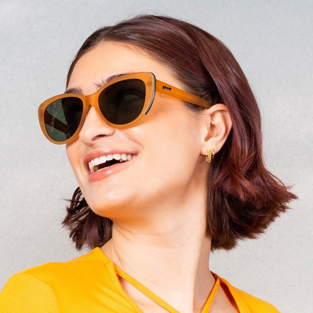 Pair of Glam G polarized sunglasses by Rare Air Discs featuring western-inspired accessories in a stylish lifestyle setting.