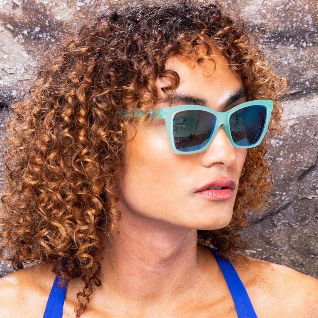 Pair of Rare Air Discs "Will Brake For Mermaids" polarized Pop G sunglasses in a lifestyle setting, showcasing stylish accessory design.