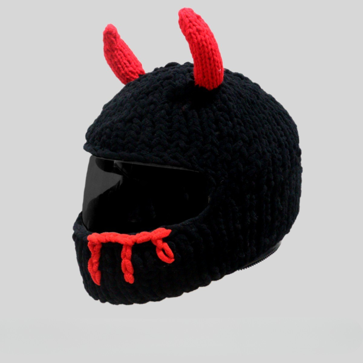Handmade knitted little devil helmet cover by Bean's Moto Booth, colorful accessory designed to fit motorcycle helmets.