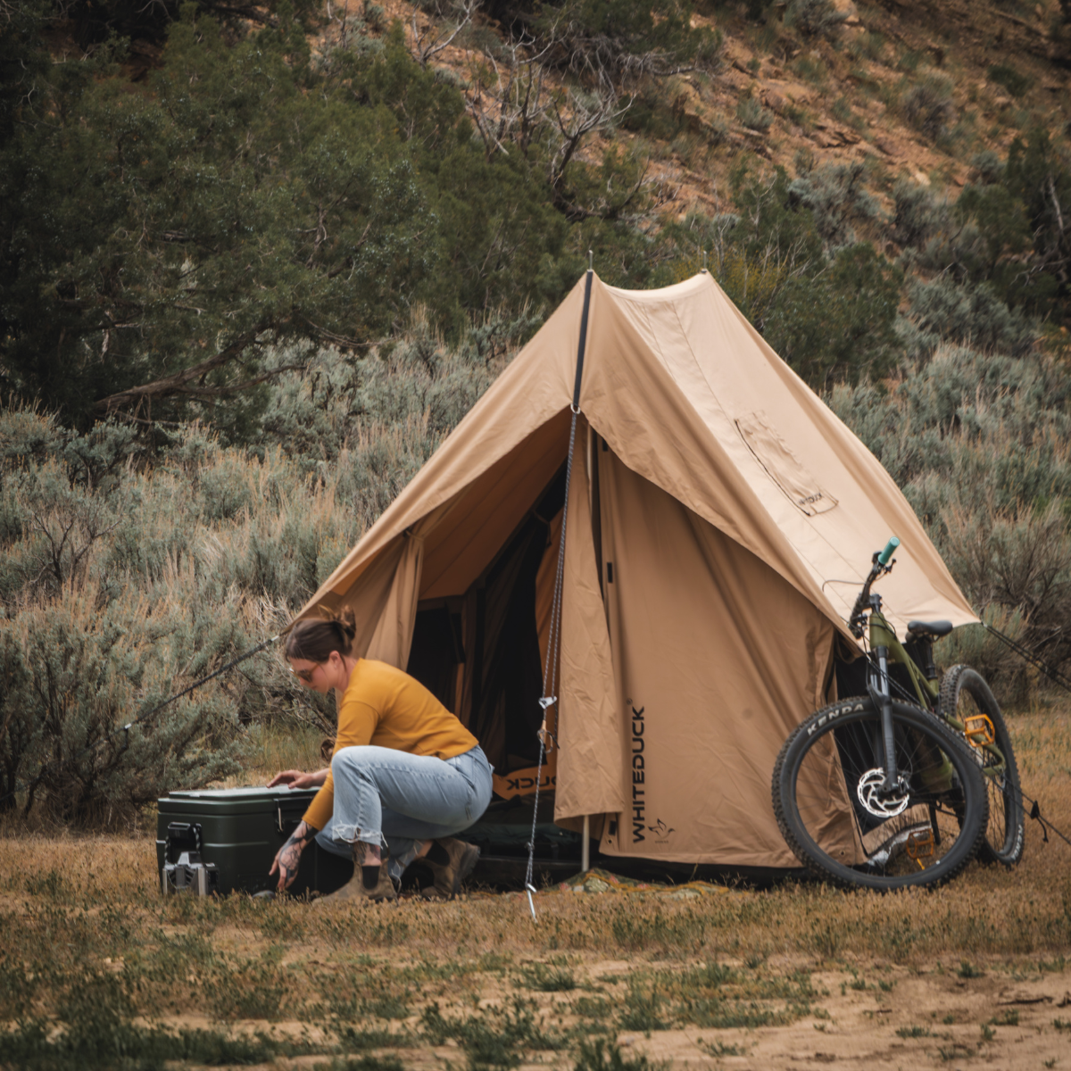 White Duck Outdoors Rover Scout Tent in 6x8 feet, shown set up outdoors with rainfly and mesh windows for camping adventures.