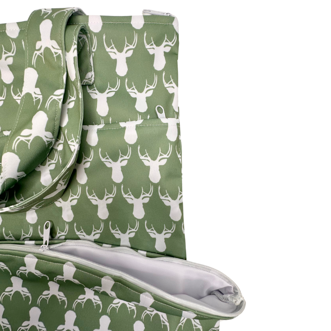 Large hanging wetbag with antler design by The Good Village Cloth Co., featuring a spacious waterproof bag for wet items.