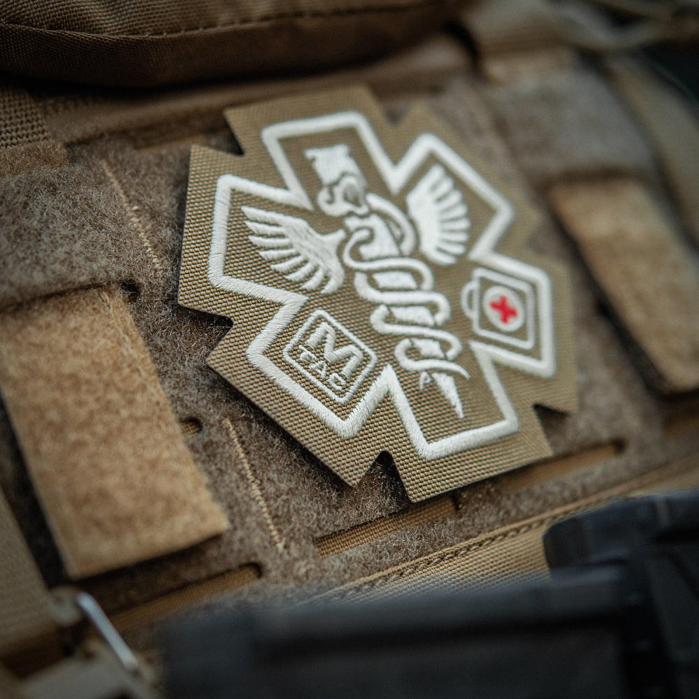M-Tac Paramedic embroidered patch featuring a detailed medical symbol on a durable fabric background.