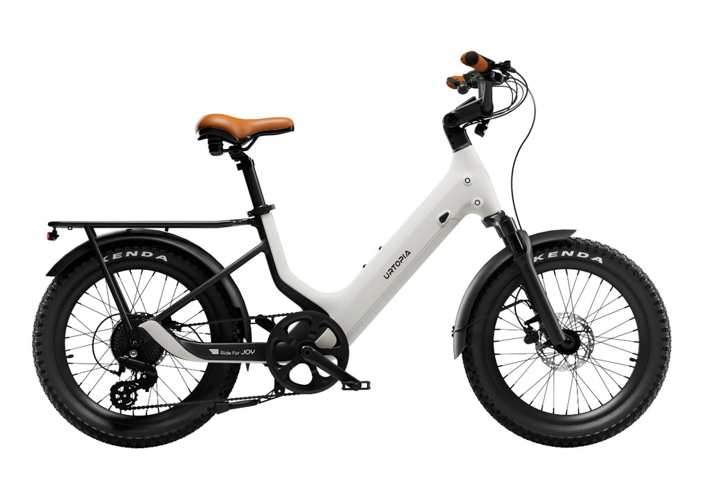 Rex E-Bikes Urtopia Joy Carbon E-Bike with sleek frame, electric motor, and modern design, parked on a city street.