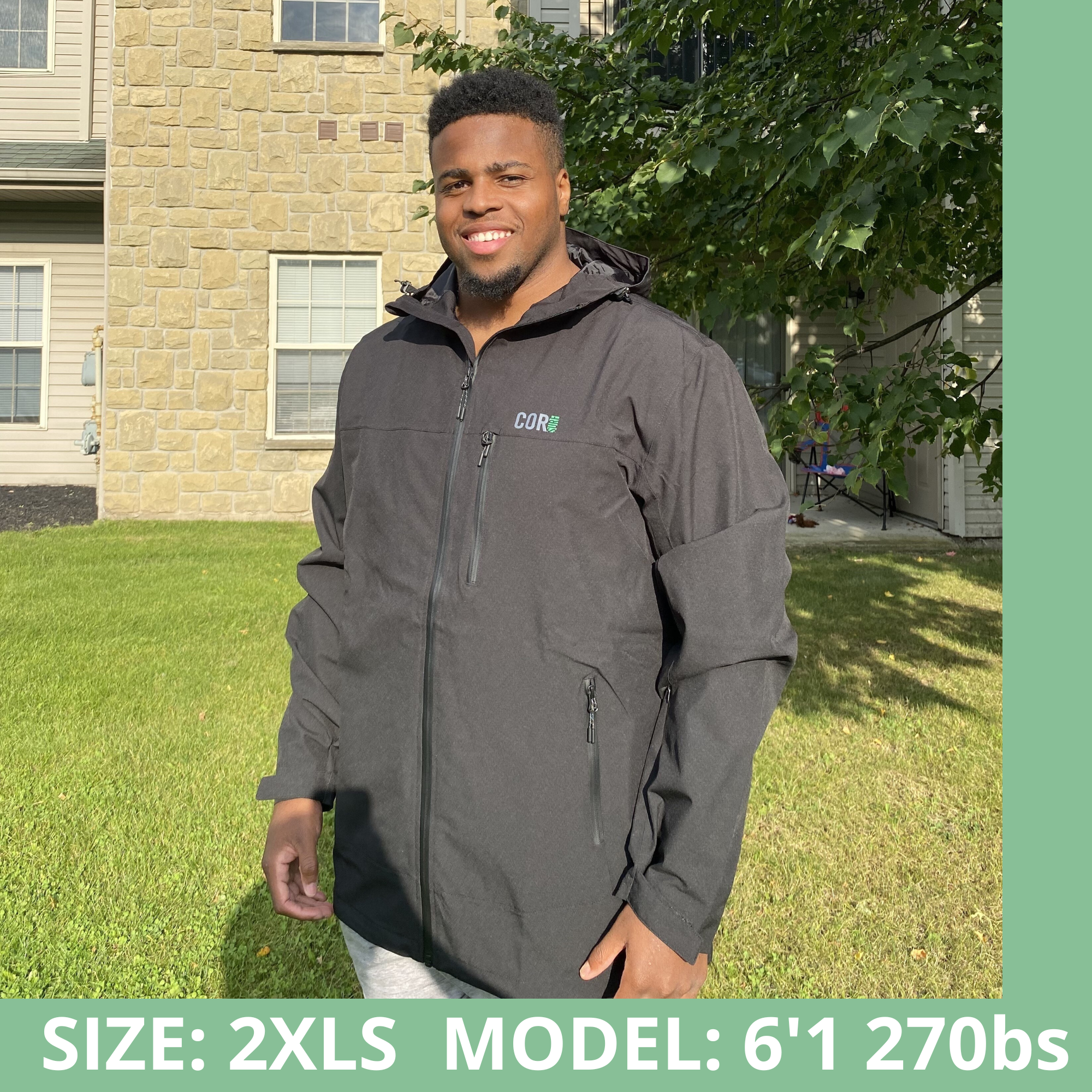Green unisex Huakai Travel Rain Jacket by COR Surf, lightweight waterproof apparel with a hood and adjustable cuffs.