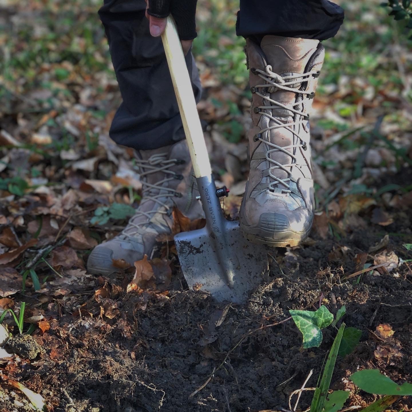 Near Zero Outdoor Gear titanium shovel, durable accessories tool with a sturdy metal blade and ergonomic handle for outdoor activities.