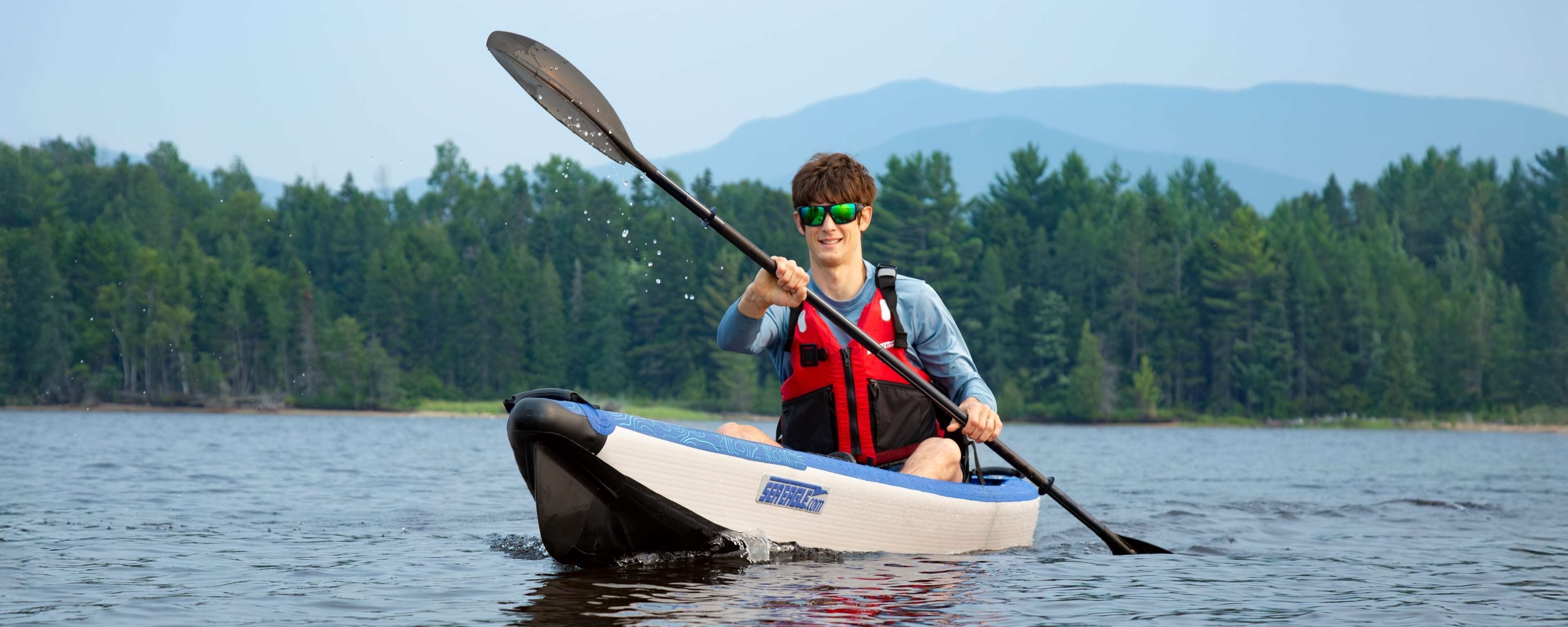 Backcountry Sportsman RazorLite™ 393rl inflatable kayak on water, showcasing its sleek design and durable construction.