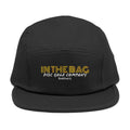 Embroidered 5-panel cap by In The Bag Disc Golf Company, shown resting on a flat surface with visible logo details.
