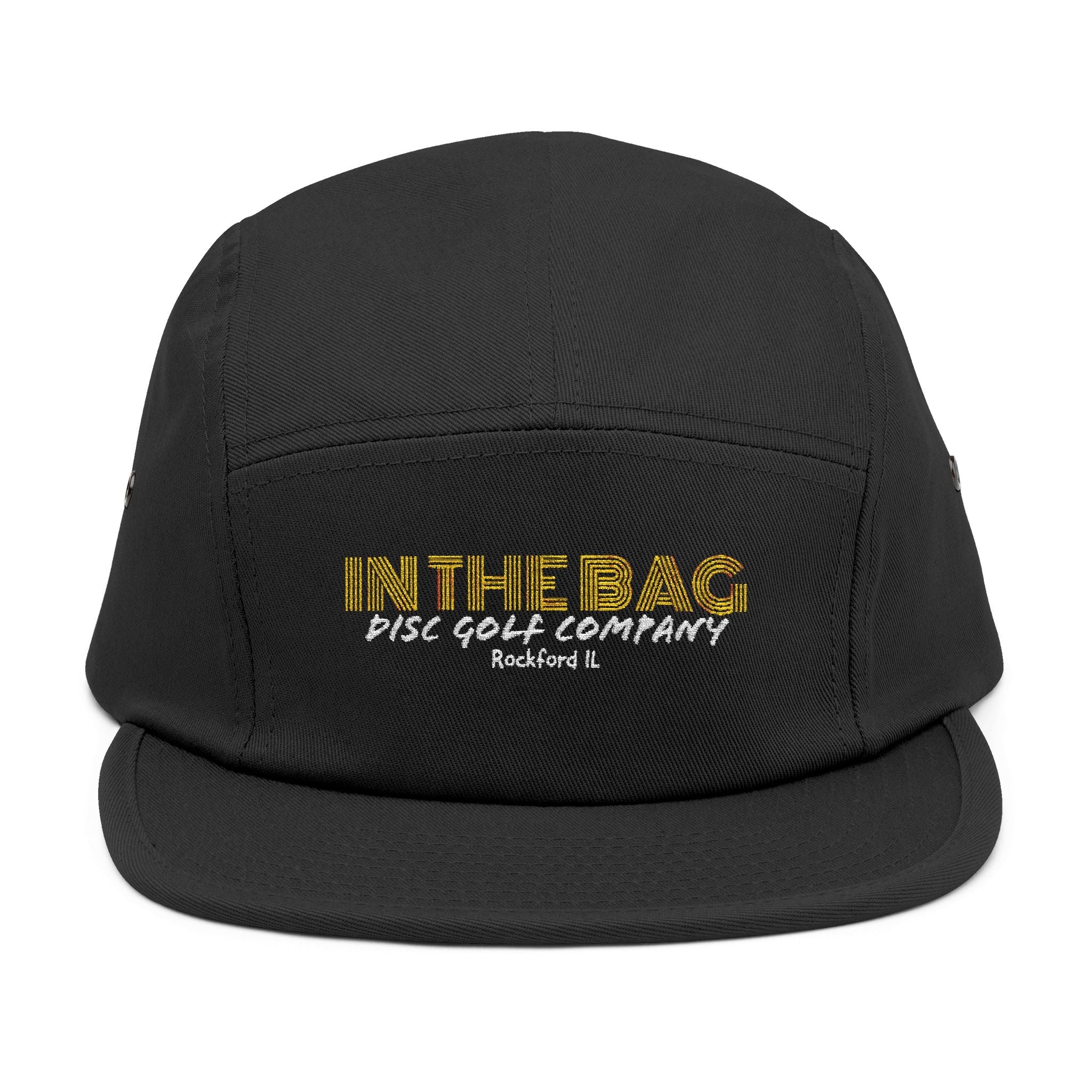 Embroidered 5-panel cap by In The Bag Disc Golf Company, shown resting on a flat surface with visible logo details.