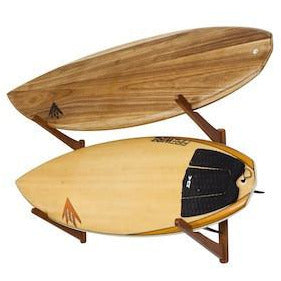 White bamboo triple surfboard wall rack by COR Surf holding surf, wake, snowboards, and skateboards for organized storage.