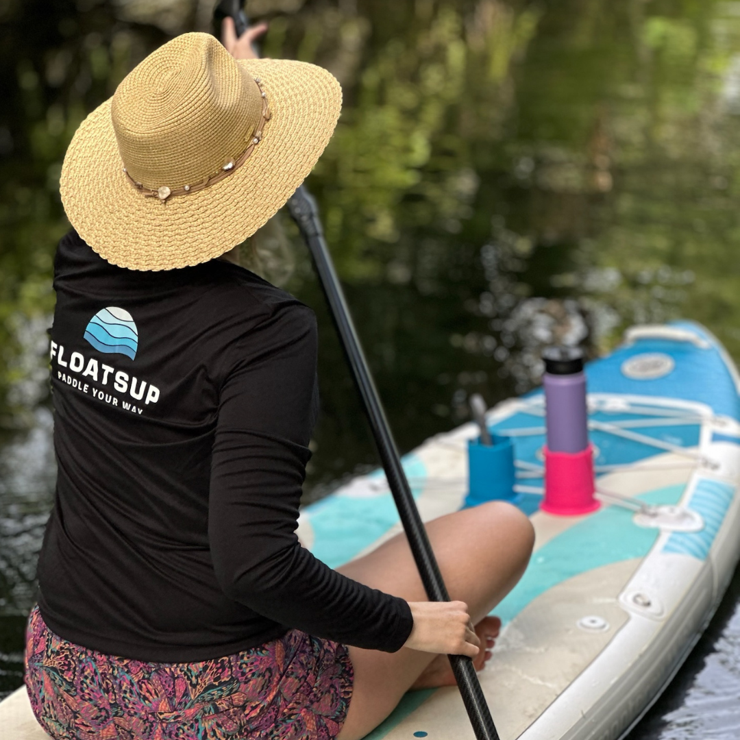 Floatsup® Cup Drink Holder floating in water, designed for sporting events and outdoor activities to keep beverages secure.