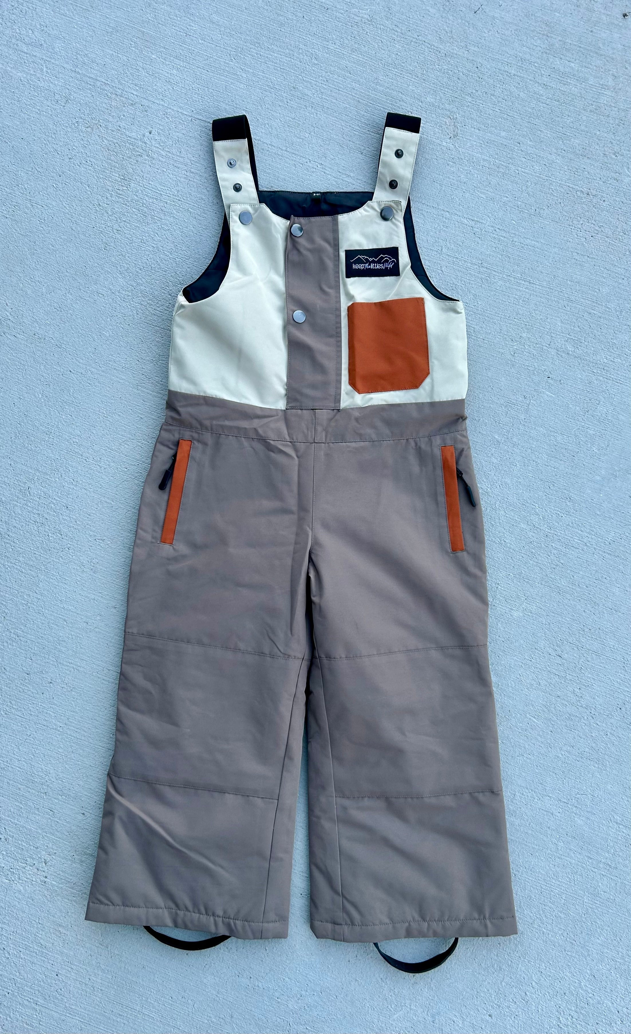 Youth and toddler waterproof snow bib by Keep the Littles Wild, showing adjustable straps and insulated, snow-resistant fabric.