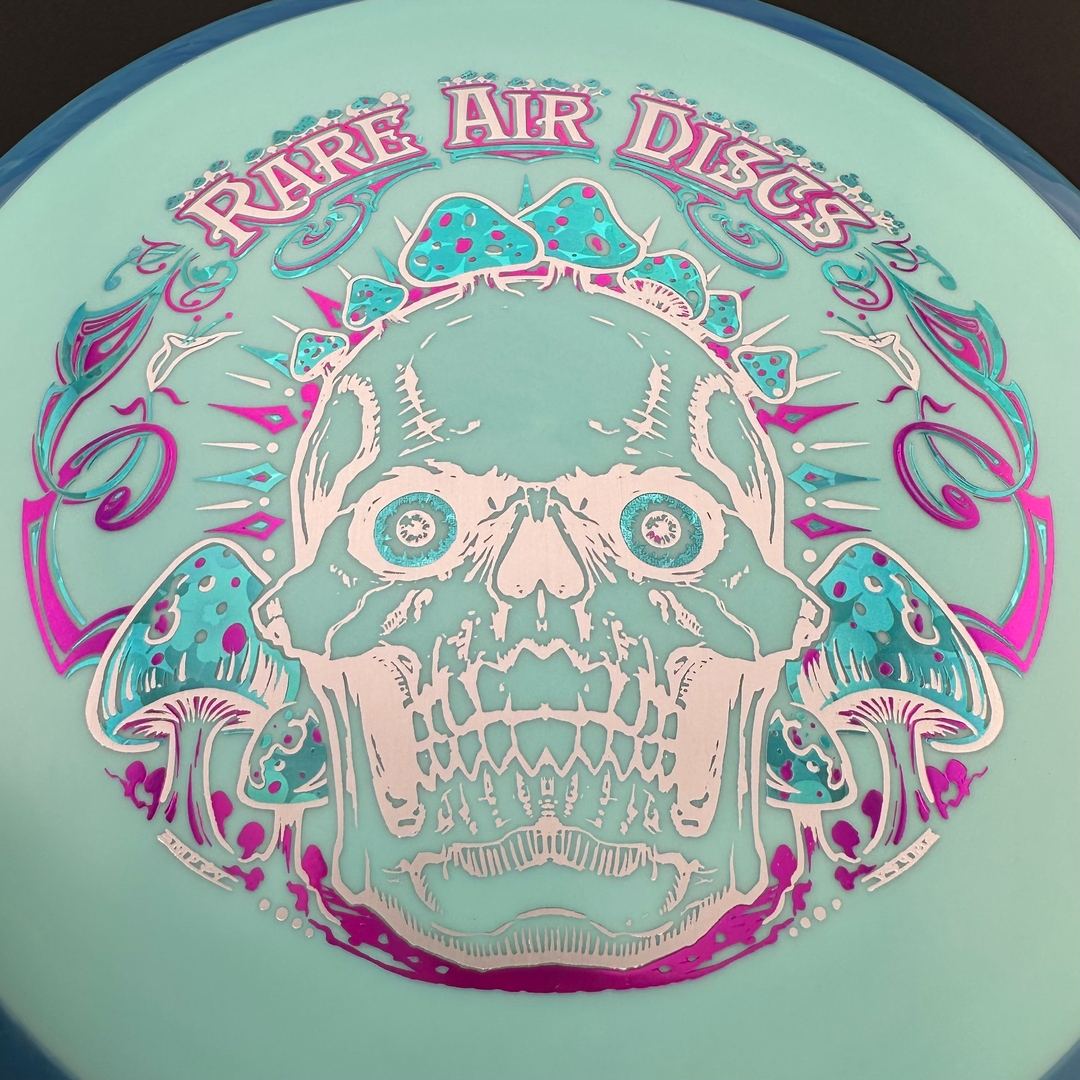 Fission Defy Crushin' Amanitas VIP 2.0 disc golf disc by Rare Air Discs, featuring vibrant artwork and branding.