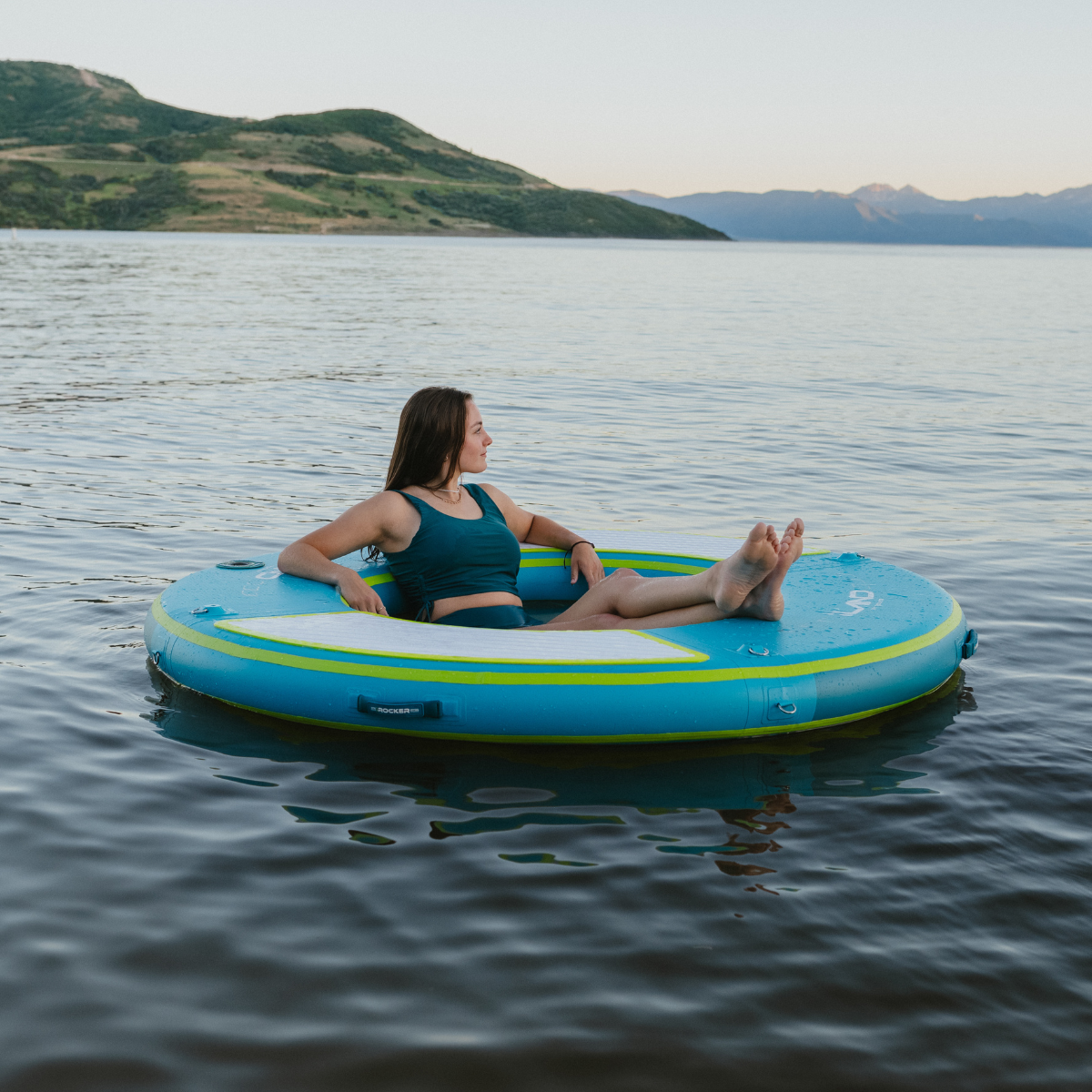 iLAND® by iROCKER 6-foot round float in vibrant colors, perfect for relaxing on the water.