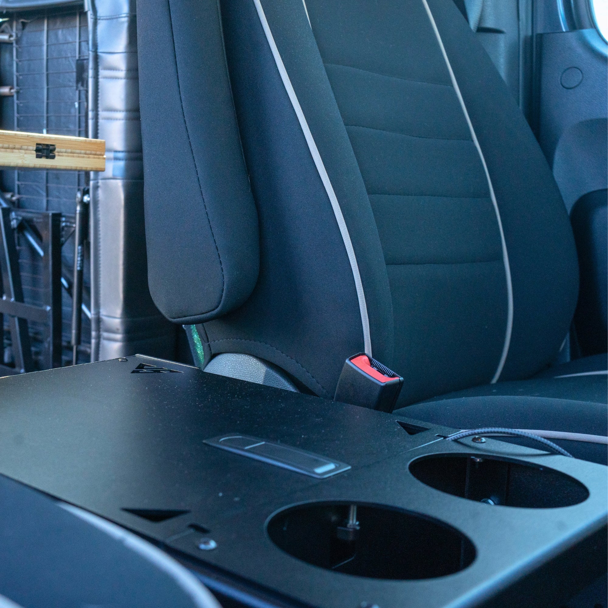 The Van Mart Sprinter Scout Center Console Box in a vehicle, showcasing its storage capacity and sleek design.