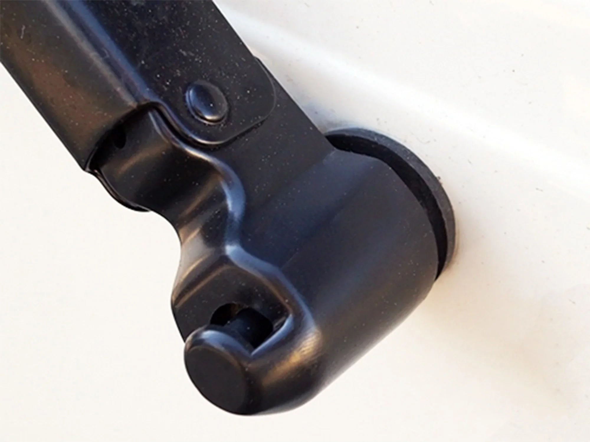 GoWesty rear wiper arm cover installed on 1993-2003 Eurovan, showing the black plastic part for rear window wiper protection.