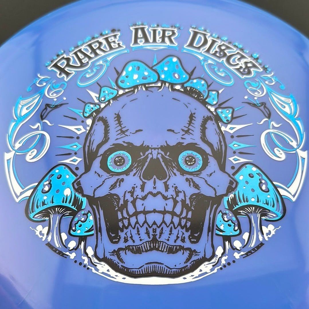 Ethereal Construct Crushin' Amanitas disc golf stamp by Manny Trujillo on a Rare Air Discs disc, featuring colorful mushroom artwork.