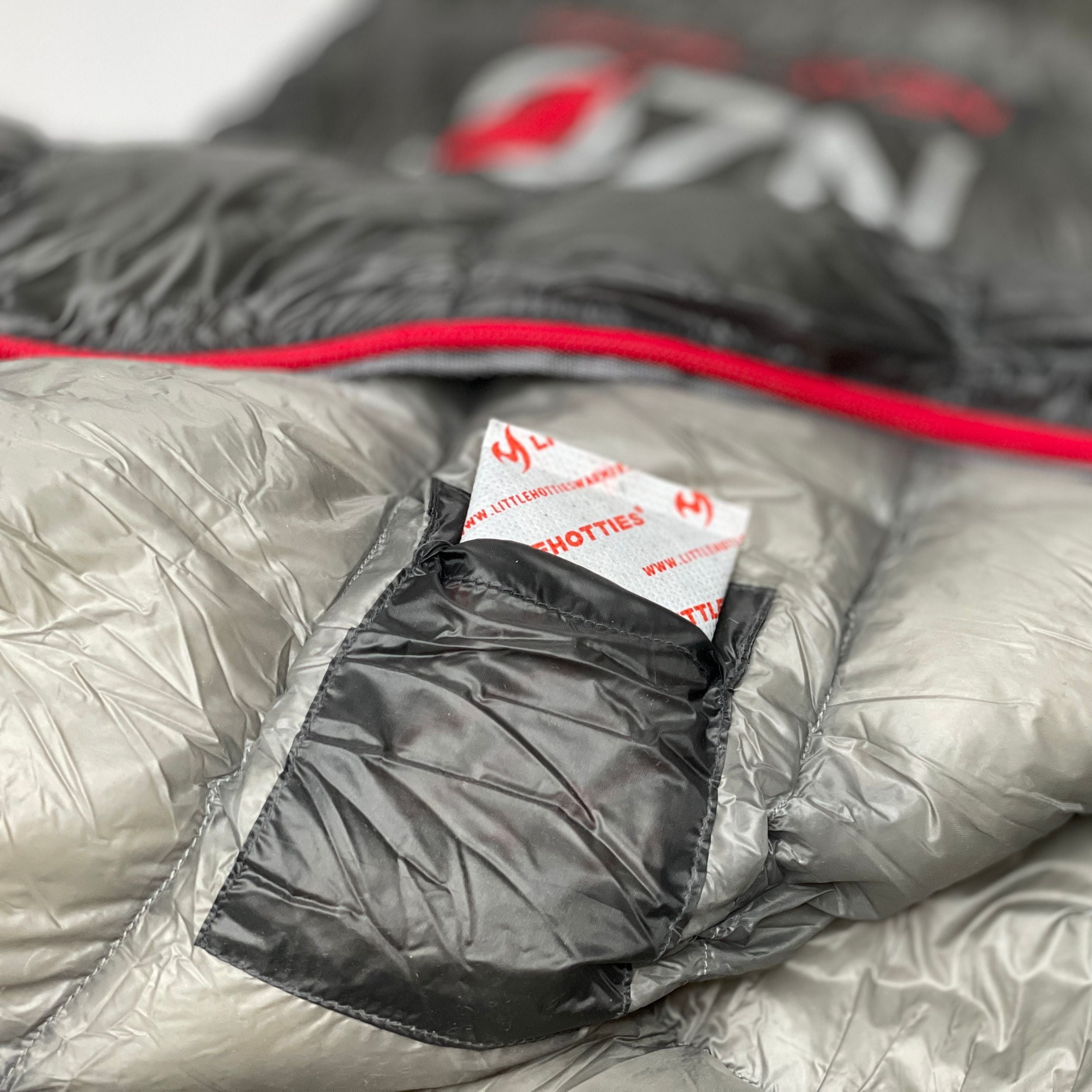 Near Zero Outdoor Gear NZ 35 Mummy Sleeping Bag laid out, showing its insulated design and compact shape for outdoor camping.