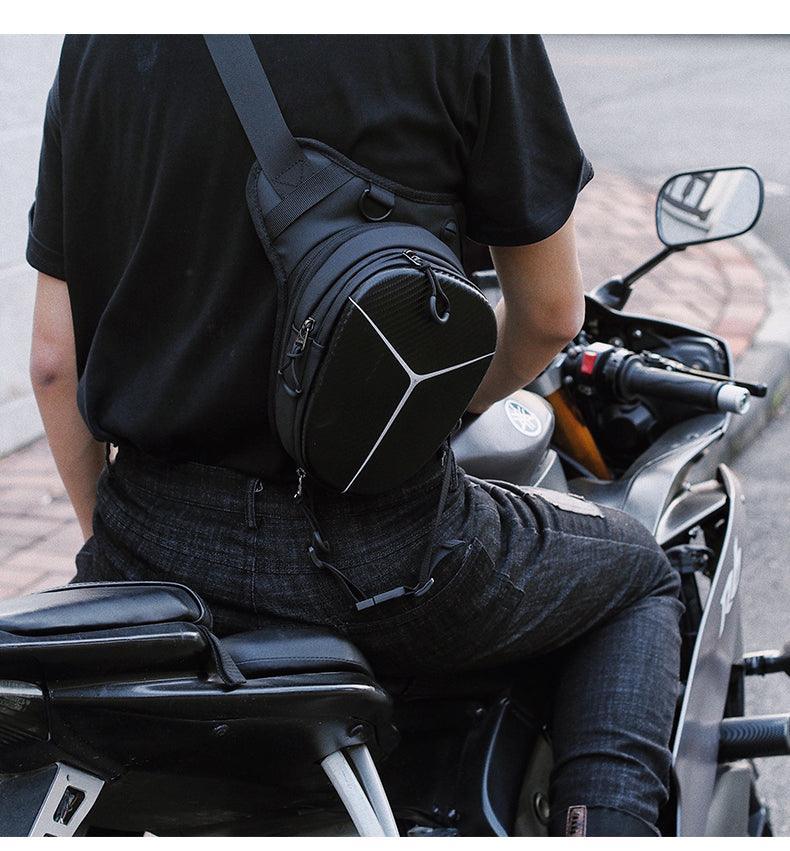 Albers ShadowStrike motorcycle leg bag from Bean's Moto Booth, black leather with adjustable straps and multiple storage compartments.