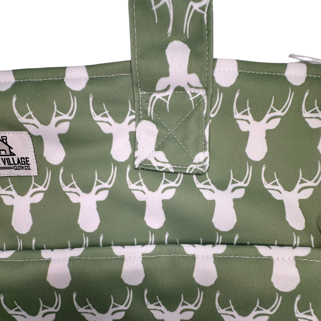 Large hanging wetbag with antler design from The Good Village Cloth Co., waterproof fabric for storing wet clothes or swimwear.