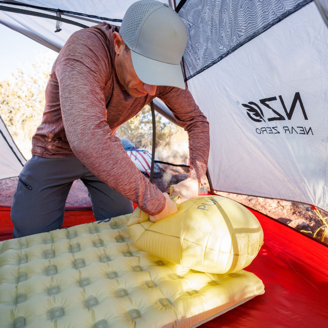 Near Zero Outdoor Gear insulated inflatable sleeping pad with a lightweight, cushioned surface suitable for camping and outdoor sleeping.
