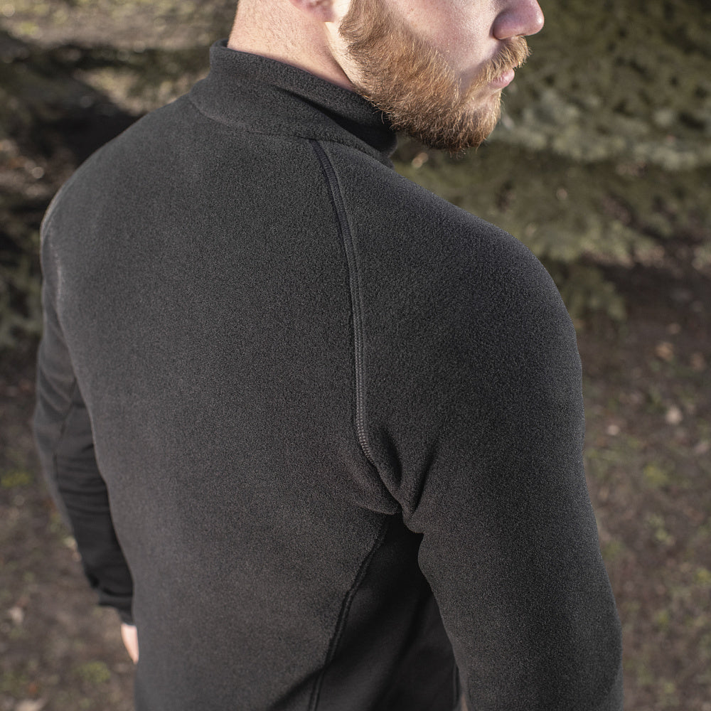 M-TAC Polartec fleece jacket in black, showcasing a cozy design, full zip, and practical pockets for outdoor activities.