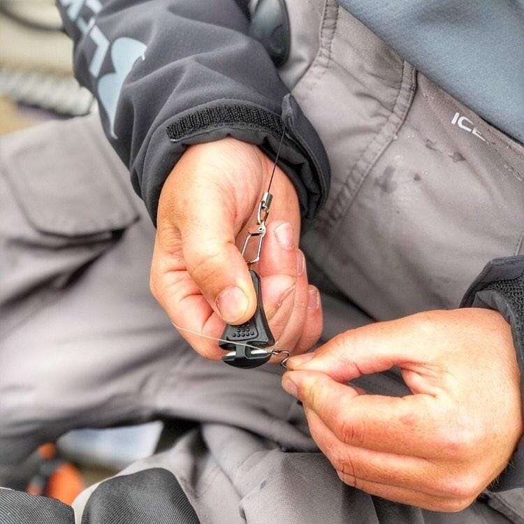 Glow-in-the-dark Line Cutterz zipper pull featuring a ceramic blade design, ideal for easy access and functionality.
