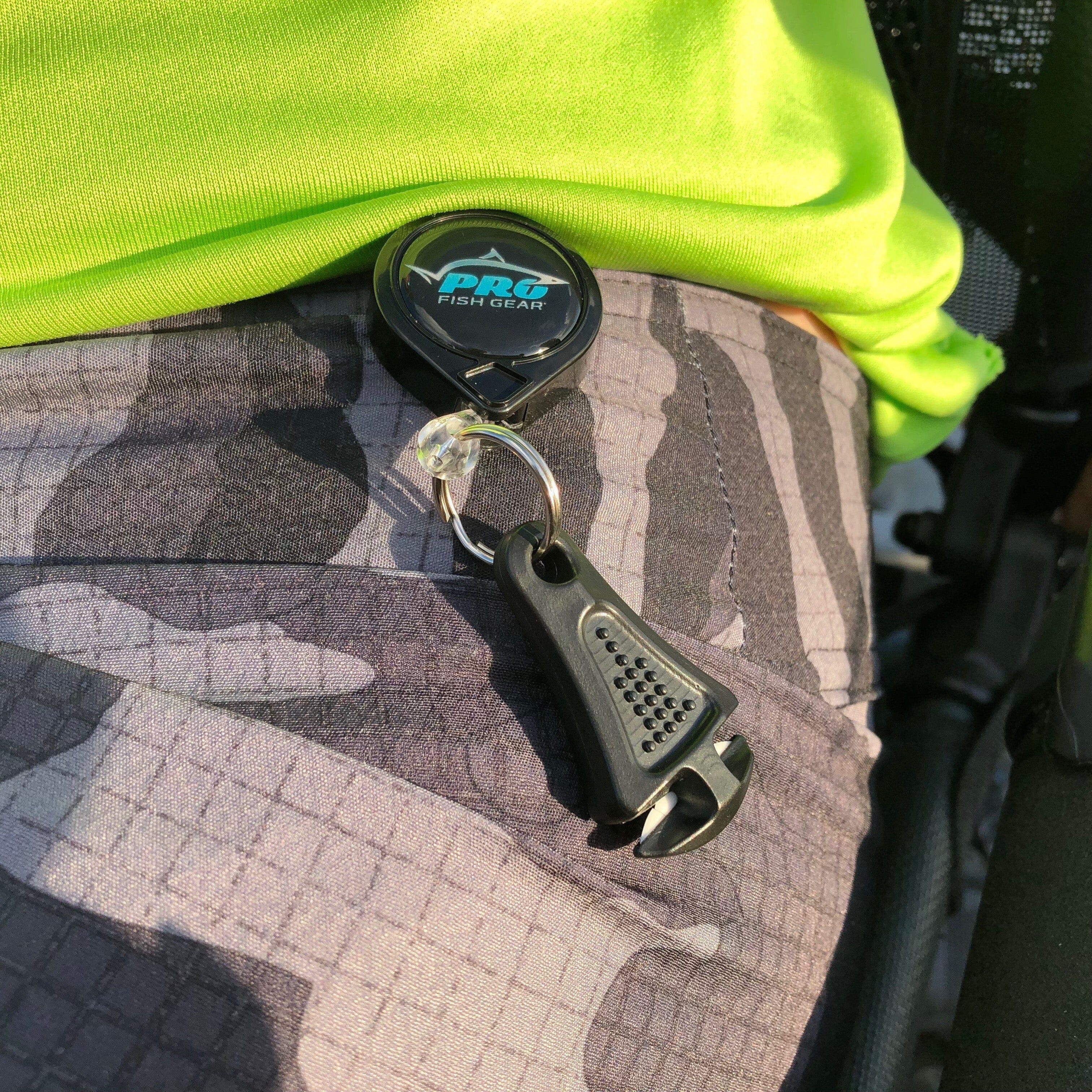 Glow-in-the-dark Line Cutterz zipper pull with a ceramic blade, showcasing its unique design and functionality.