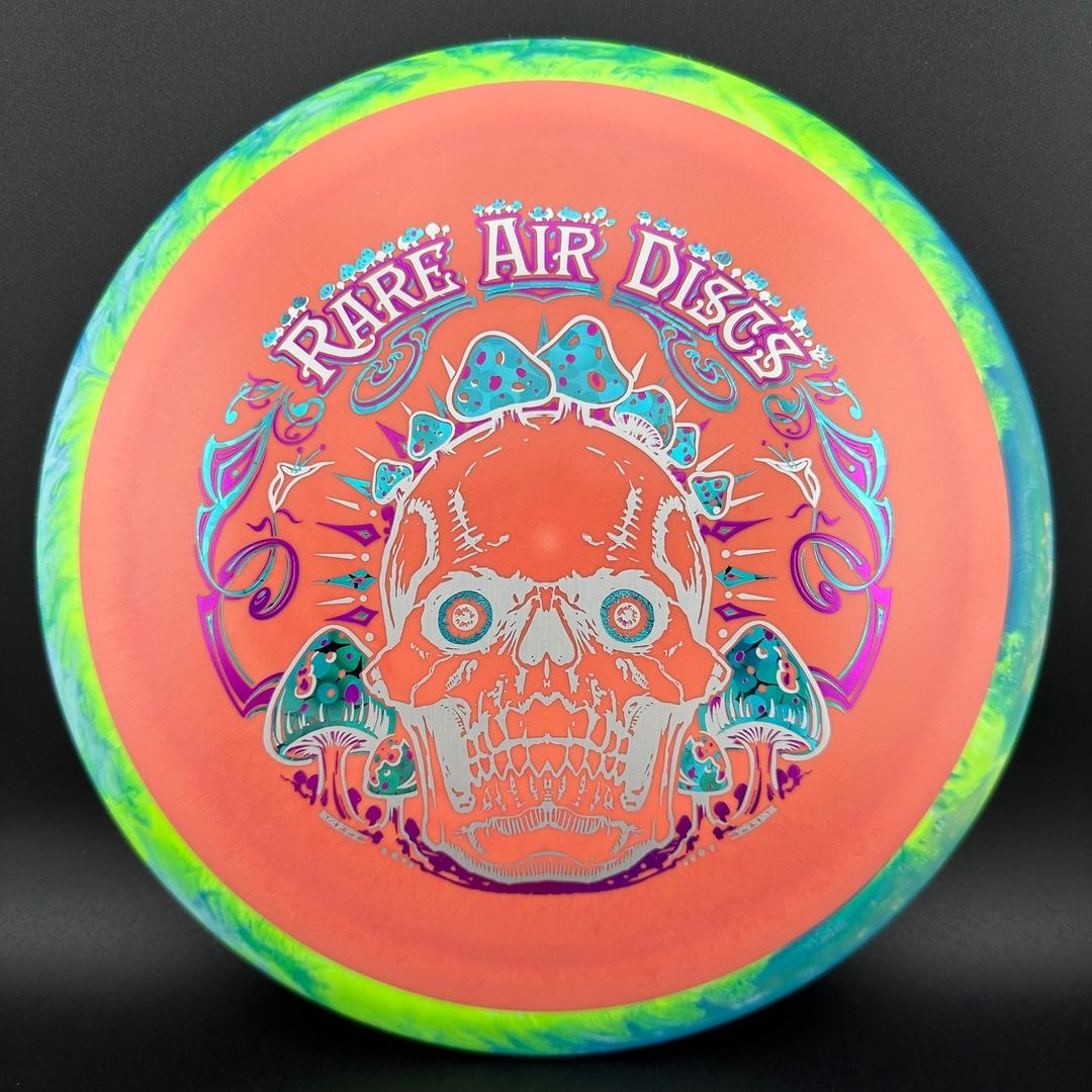Rare Air Discs Fission Defy Crushin' Amanitas VIP 2.0 disc golf disc with vibrant design and bold branding.