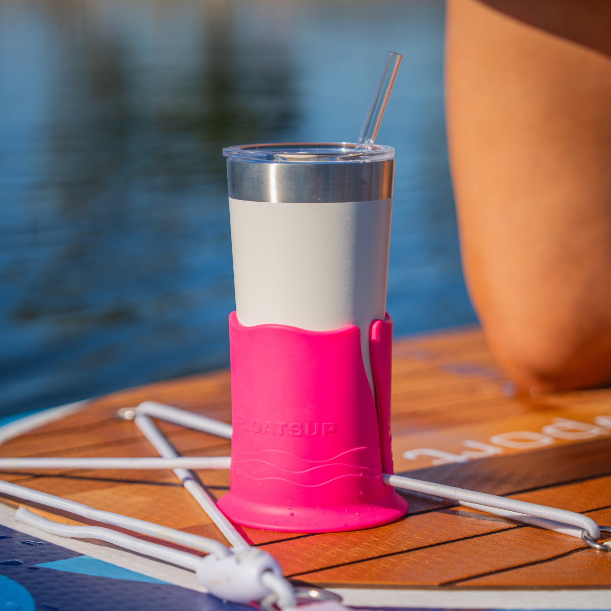 Floatsup® Cup Drink Holder for sporting goods, shown attached to a beach chair with a beverage in the holder.