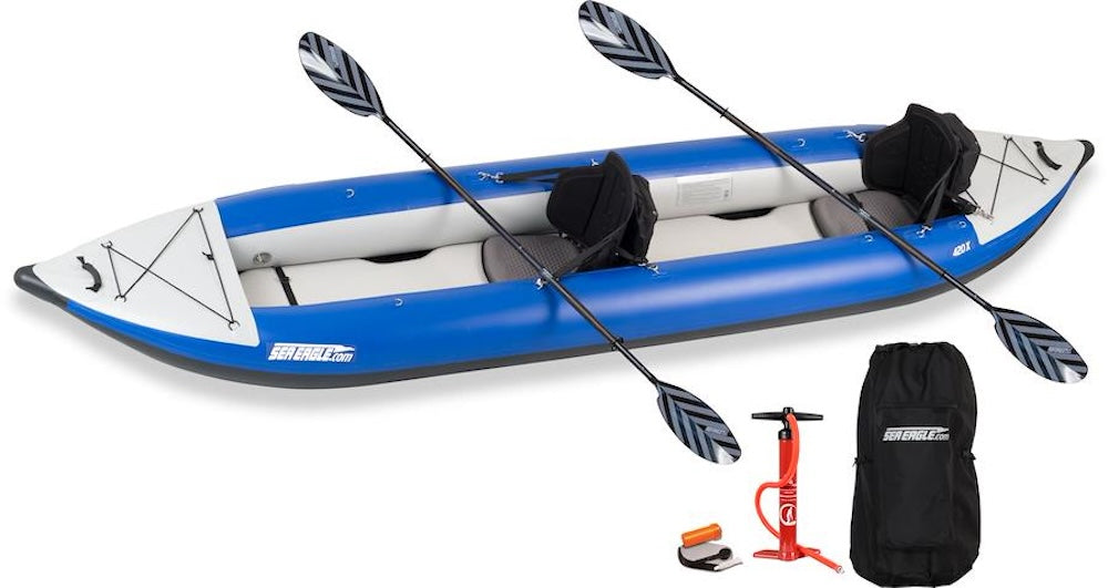 Backcountry Sportsman 420x Explorer inflatable kayak in vibrant green, fully inflated on calm water with paddles attached.
