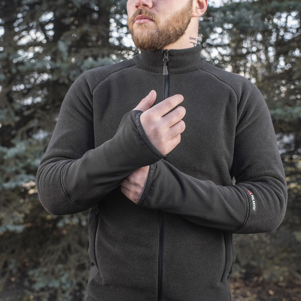 M-TAC Polartec Sport fleece jacket in dark color with zip front and adjustable cuffs, ideal for outdoor activities.