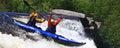 Backcountry Sportsman 420x Explorer inflatable kayak in orange, fully inflated with paddles and safety gear on water.