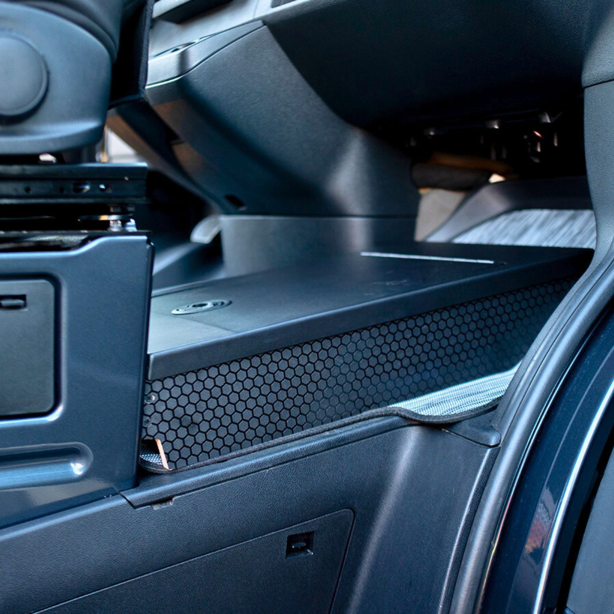 Sprinter footrest storage by The Van Mart showing a compact, organized interior with a built-in footrest and storage compartment.
