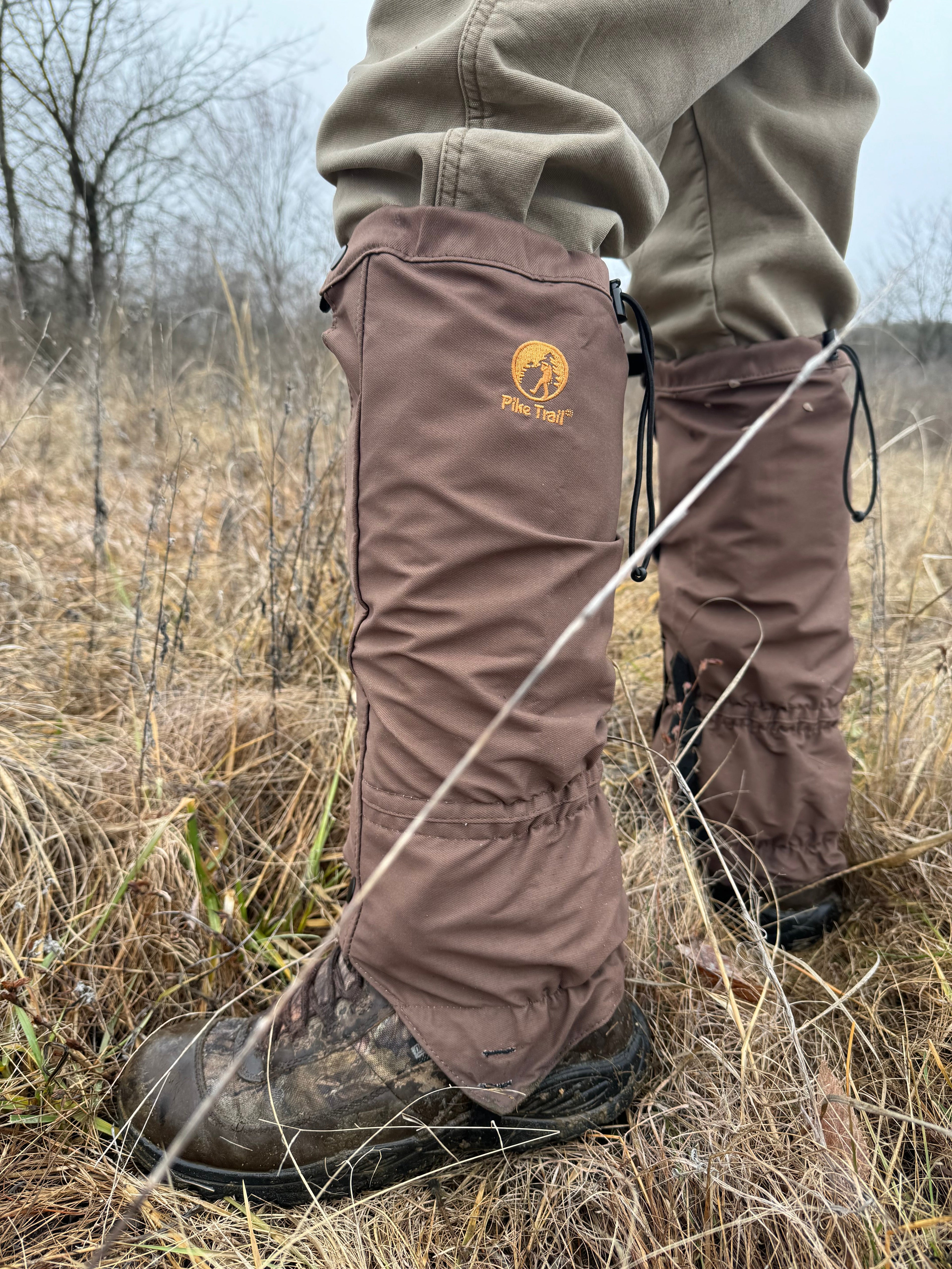 Pike Trail hiking leg gaiters shown in black, made of durable material with adjustable straps for outdoor trail protection.