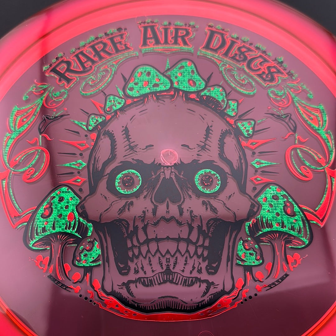 Ethos Construct Crushin' Amanitas disc golf stamp by Manny Trujillo on a Rare Air Discs disc, featuring vibrant mushroom artwork.