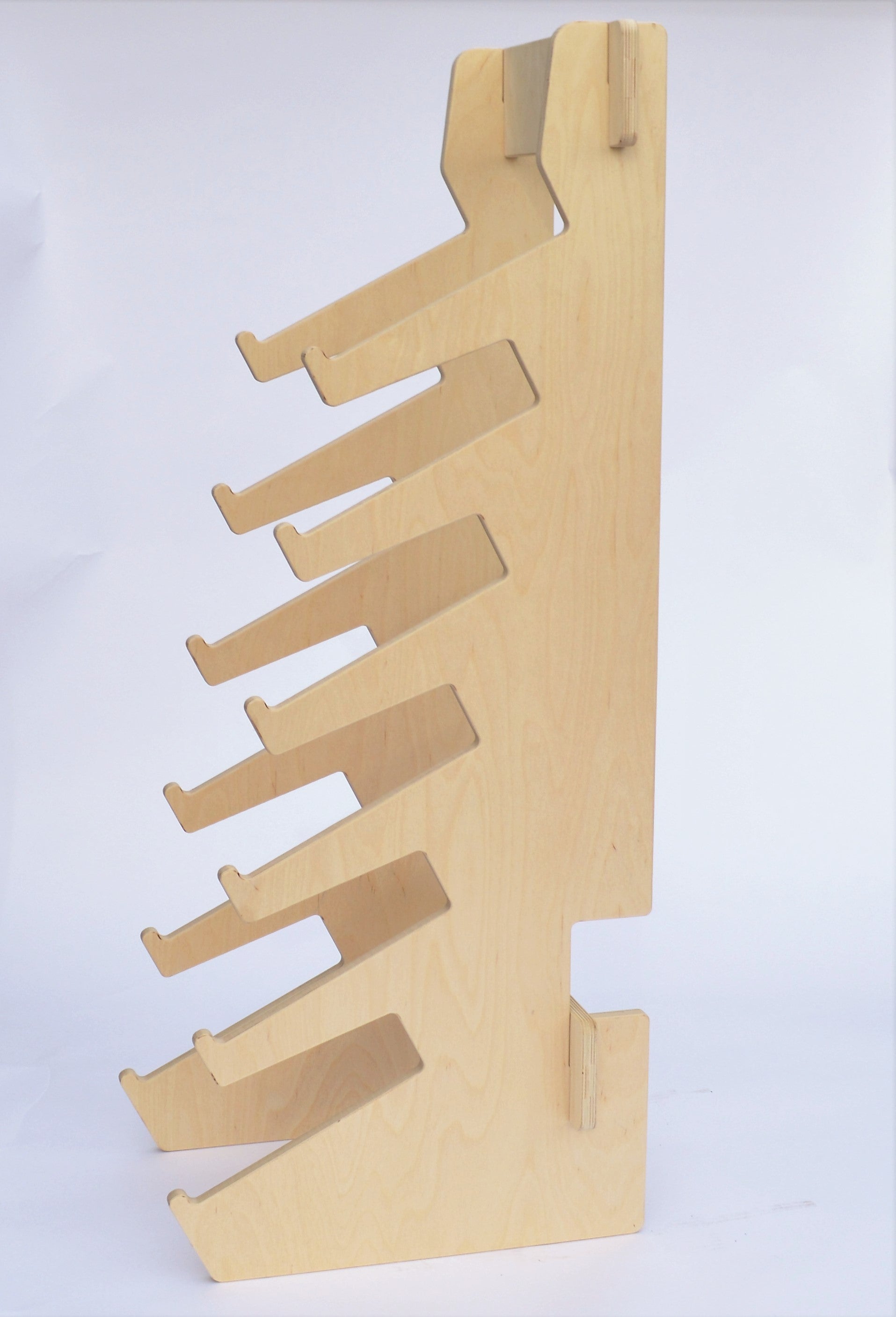 Rado Racks Boardroom skateboard floor rack holding multiple skateboards in a modern, organized display.