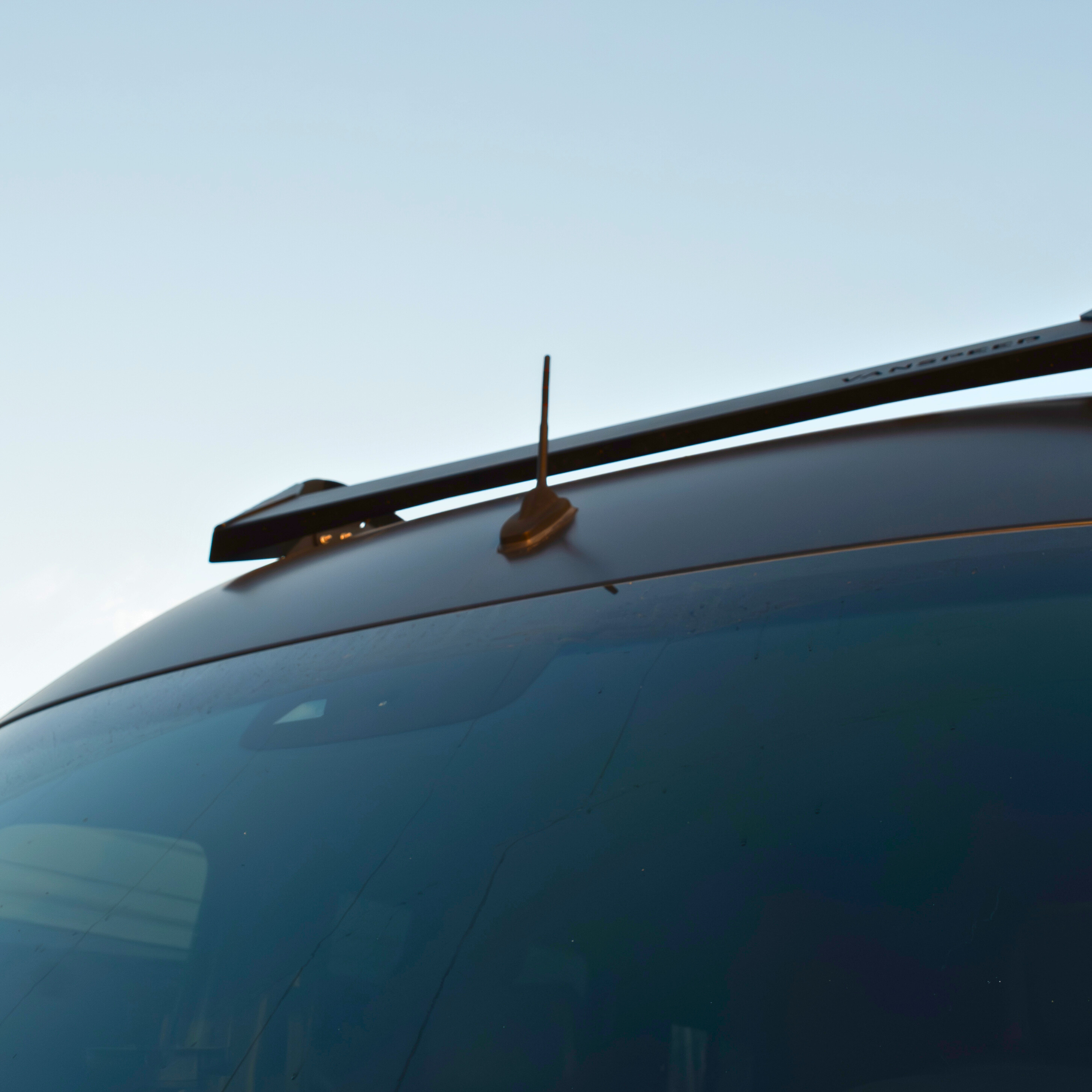 Sprinter short antenna by The Van Mart, compact black vehicle antenna for enhanced radio reception on vans.