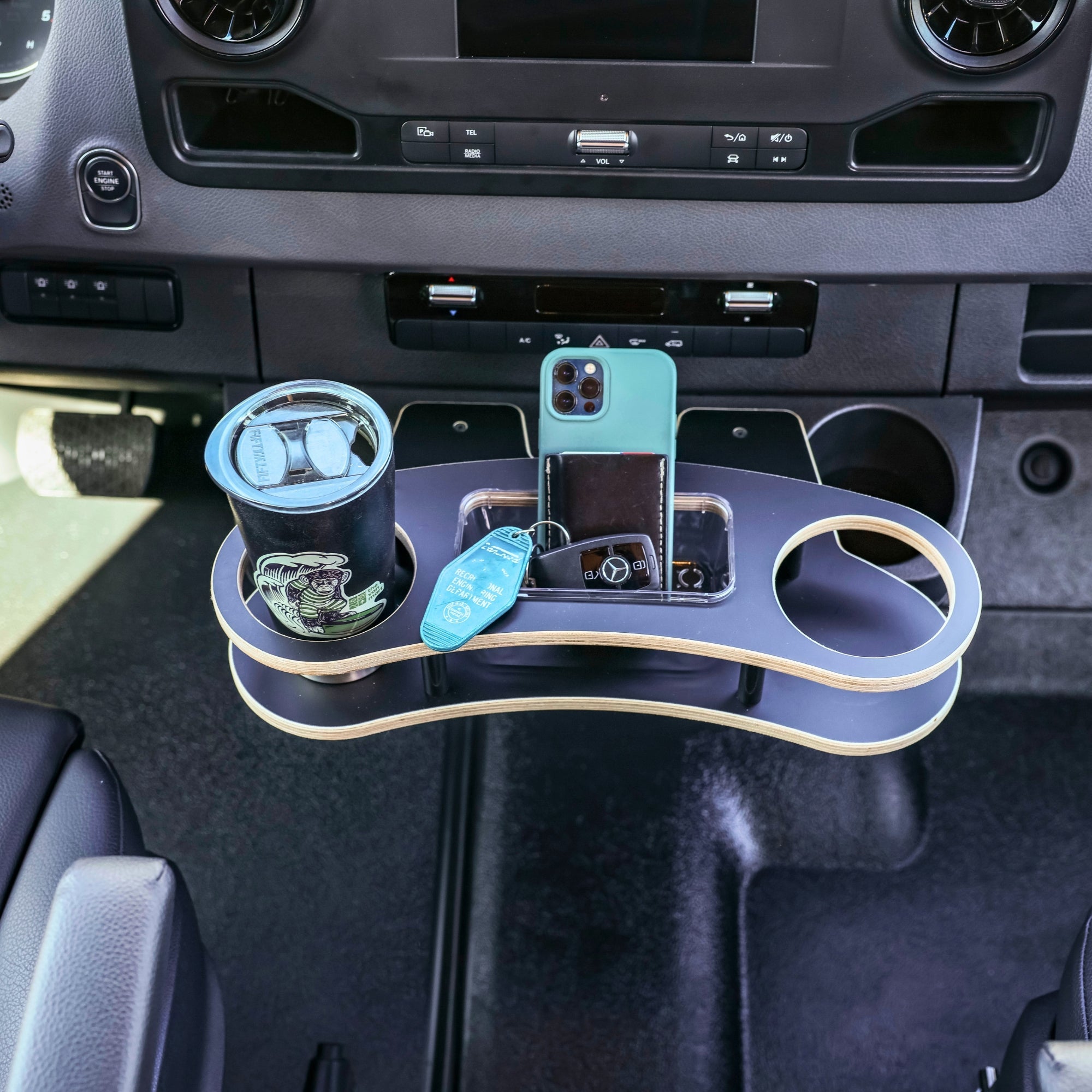 Sprinter Cupholder Tray for 2019+ van by The Van Mart, featuring a sturdy tray with cup holders for convenient vehicle storage.