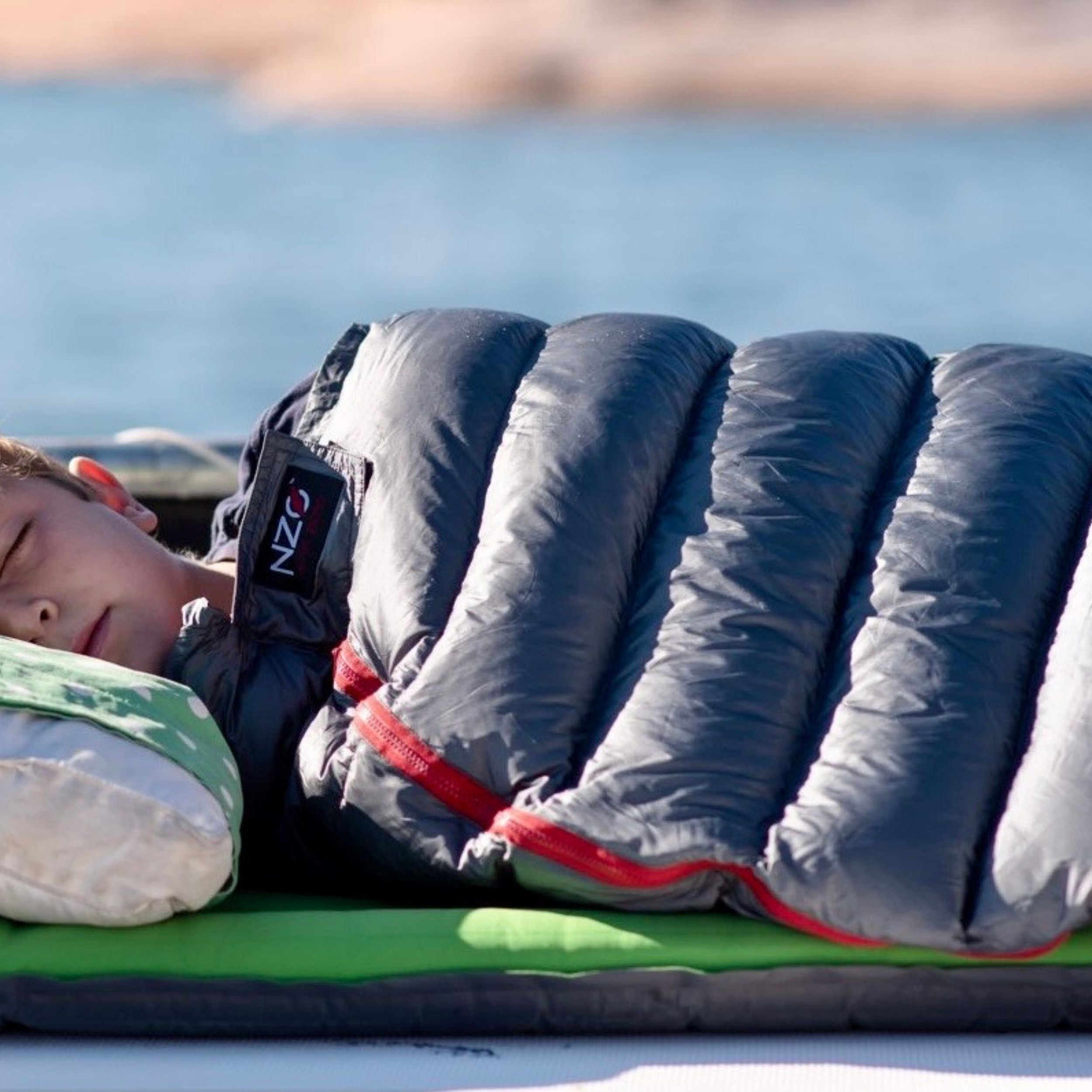 Near Zero Outdoor Gear NZ 35 Mummy Sleeping Bag laid out, showing its insulated, lightweight design ideal for camping and backpacking.