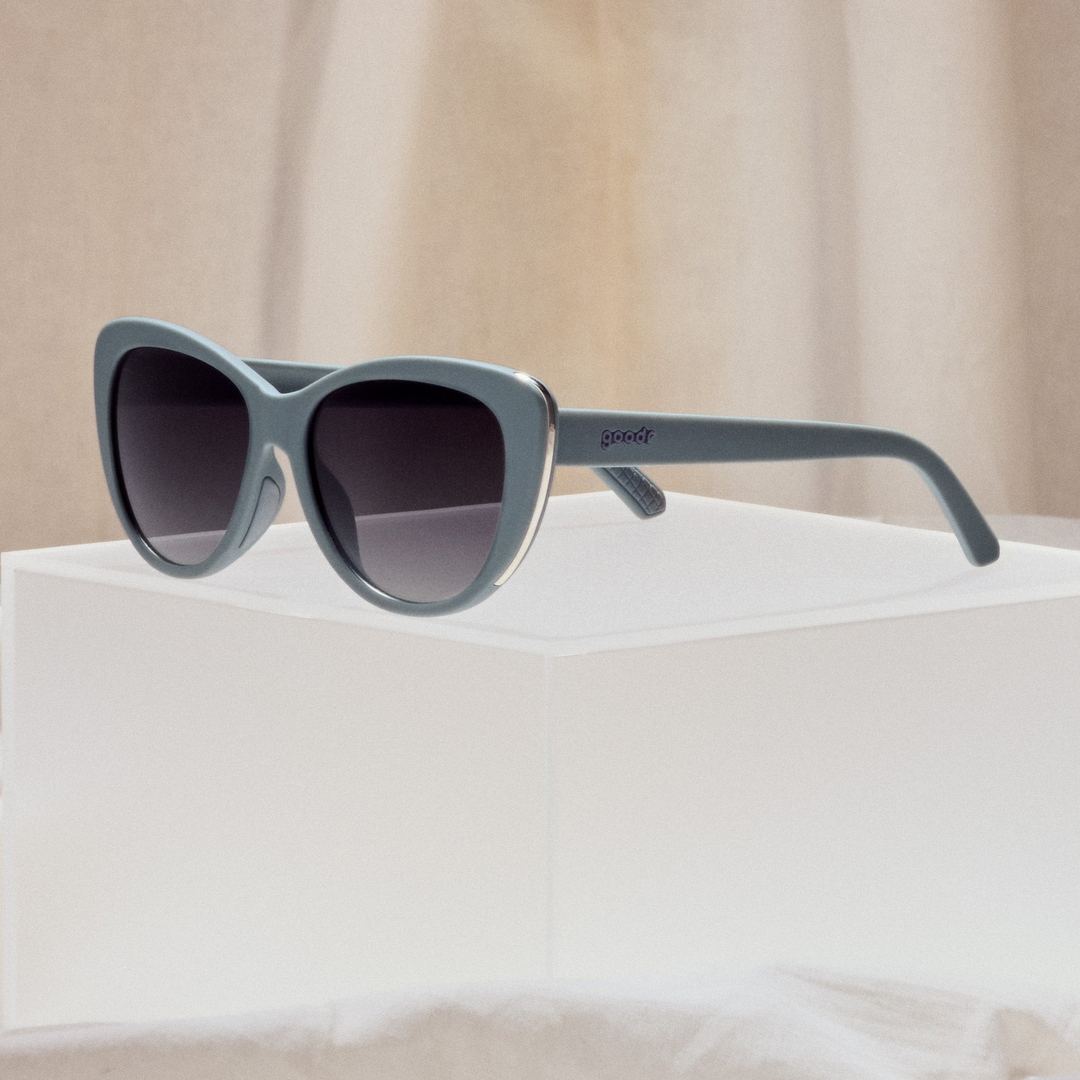 Four pairs of Rare Air Discs Not Gray, Diet Black Glam G polarized sunglasses in packaging showing stylish accessory design.