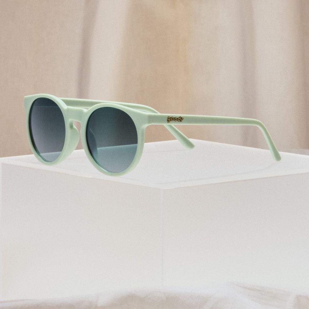 Incognito Plant Parent Circle G Polarized Sunglasses by Rare Air Discs, shown in packaging with sleek design and black frames.