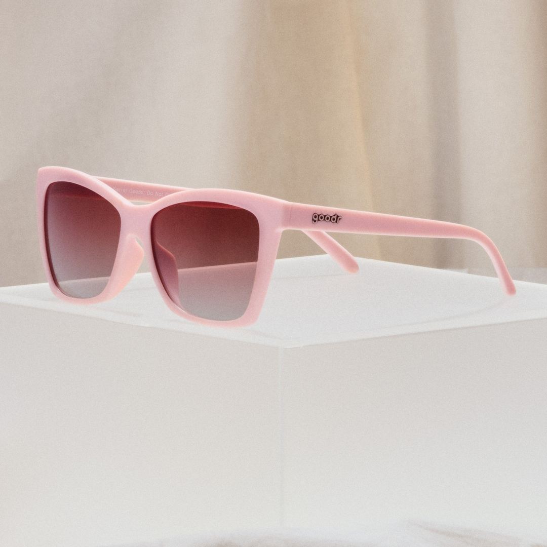 Packaging for Rare Air Discs Rosé Retail Therapy polarized pop G sunglasses, accessories with stylish branding and protective case.