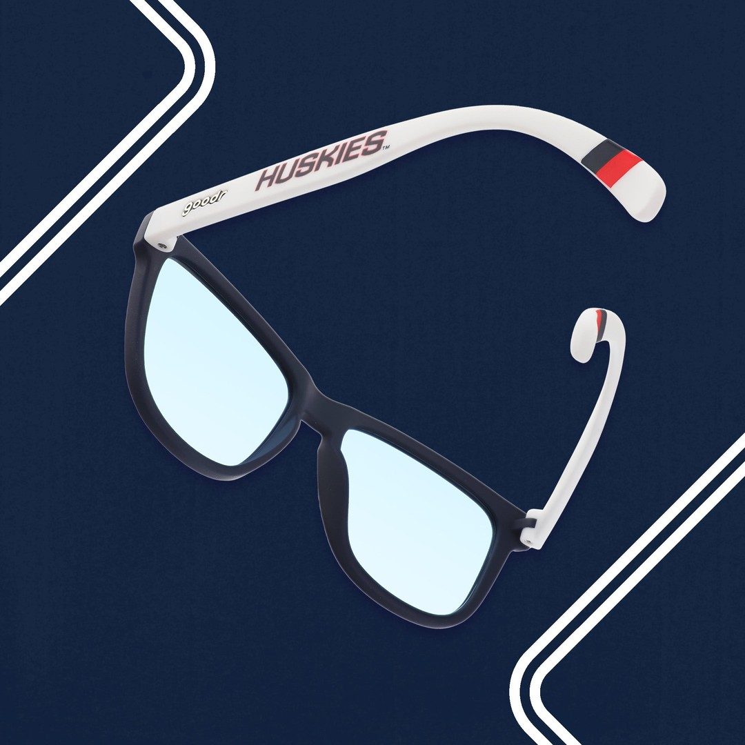 Pair of UCONN collegiate polarized sunglasses by Rare Air Discs with black frames and tinted lenses, displayed in packaging.