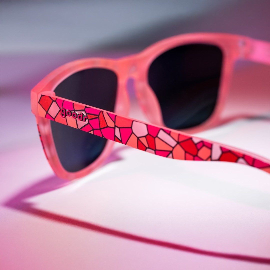Rare Air Discs Stained Glass Sex Symbol polarized sunglasses in packaging, showcasing colorful, stained glass-inspired design.