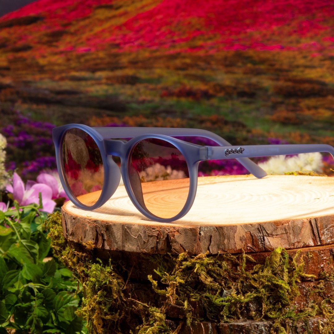Rare Air Discs "Stares Into The Abyss" circle polarized sunglasses with sleek black frame and dark lenses, displayed in packaging.
